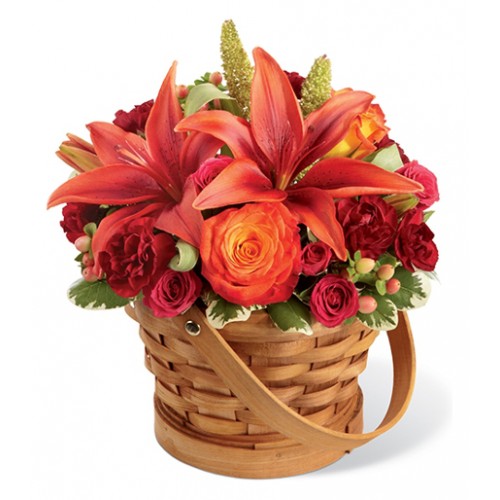Celebrate the inspiring beauty of this coming harvest season with basket of blooms in orange, burgund, fuchsia, peach & millet green.