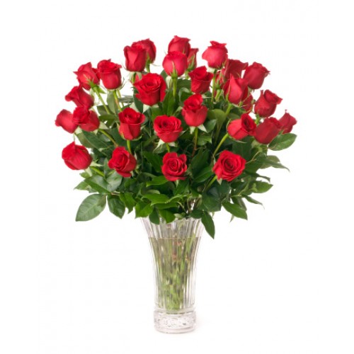 Shout your love from rooftops with 36 long-stemmed red roses artistically arranged in a cut crystal vase. She'll be yours forever.