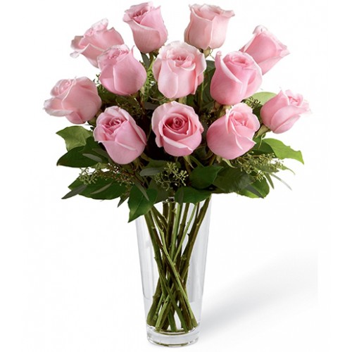 Picture-perfect soft pink roses make a beautiful gift for the lovely lady in your life. Wife, mother, daughter or sweetheart, she's sure to cherish this bouquet of pastel pink roses accented with seeded eucalyptus and arranged in a clear glass vase.