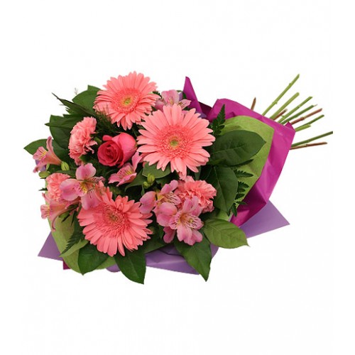 Irresistible bouquet of freshly cut pink flowers, featuring pink alstroemerias, pink gerbera daisies, pink carnations and a single pink rose.