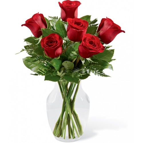 Gorgeous red roses accented with a variety of fresh greens and perfectly arranged to conveys your hearts deepest desires for love and romance.