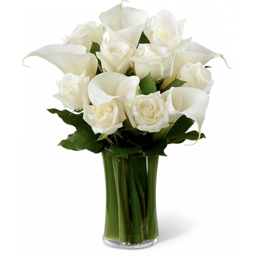Brilliant roses & calla lilies set amongst lush greens to create a gift that help your special recipient through the trying time of grief & loss.