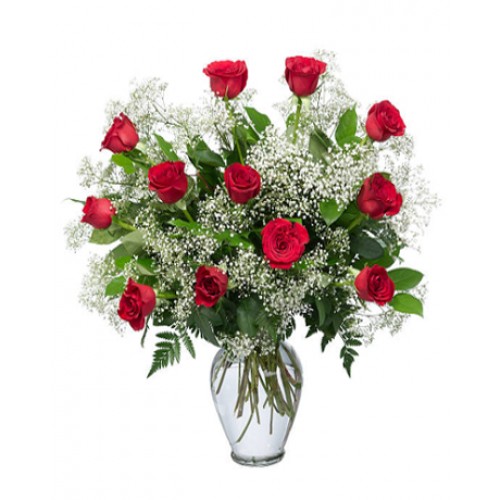 Charming bouquet includes dozen of red roses accented with white waxflower, huckleberry & pittosporum. One can be inherently happy and not smile.